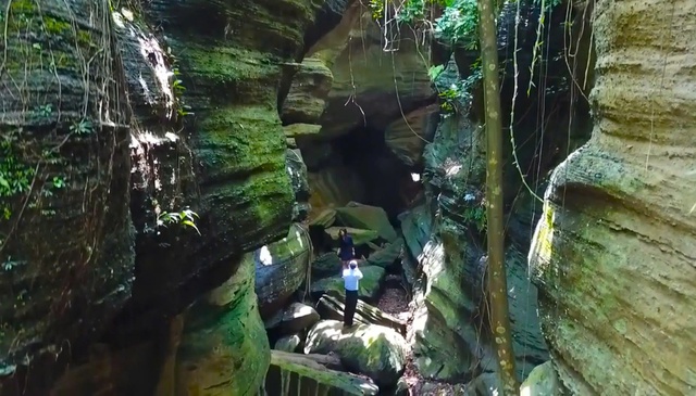 Close-up of sharp slate rocks like ancient characters engraved on the Bat Cave cliff.