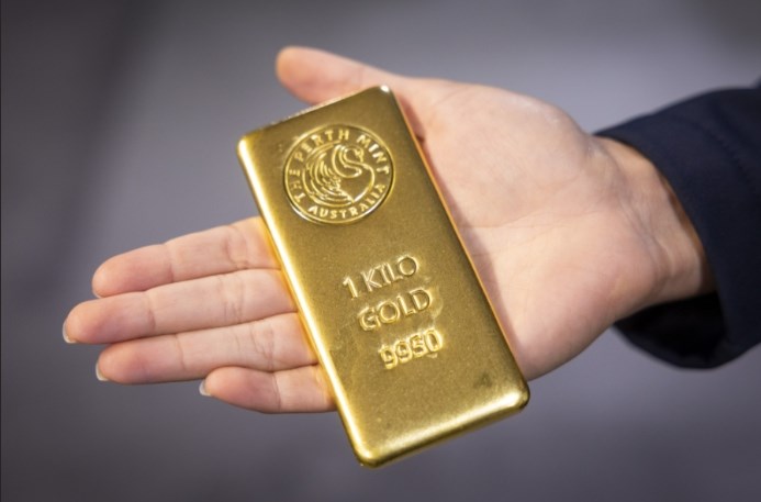 Giá vàng tăng mạnh sau khi Fed hạ lãi suất - ảnh 1
