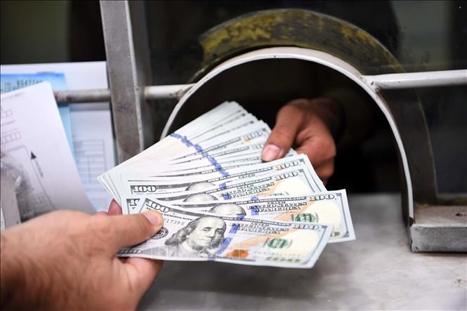 Đồng tiền USD Mỹ. Ảnh tư liệu: THX/TTXVN