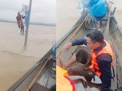 Cứu sống người suốt đêm bám vào khung pano ở cột điện giữa nước lũ