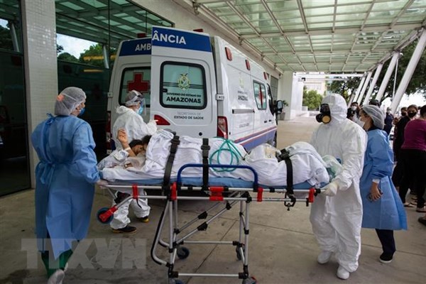Covid-19 đã cướp đi sinh mạng của gần 2,56 triệu người trên thế giới - Anh 1