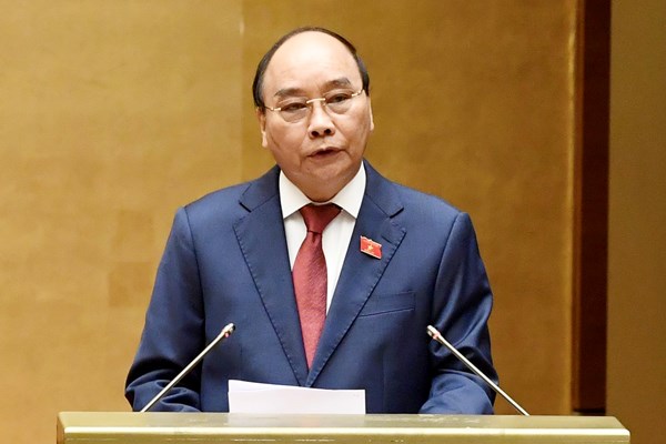 Chủ tịch nước Nguyễn Xuân Phúc: Niềm tin về một Việt Nam tất thắng đẩy lùi đại dịch Covid-19 - Anh 1
