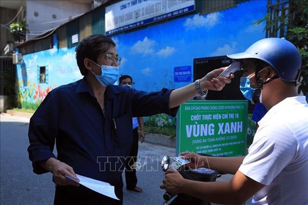 Hà Nội có thể cân nhắc điều chỉnh mẫu giấy đi đường - Anh 1