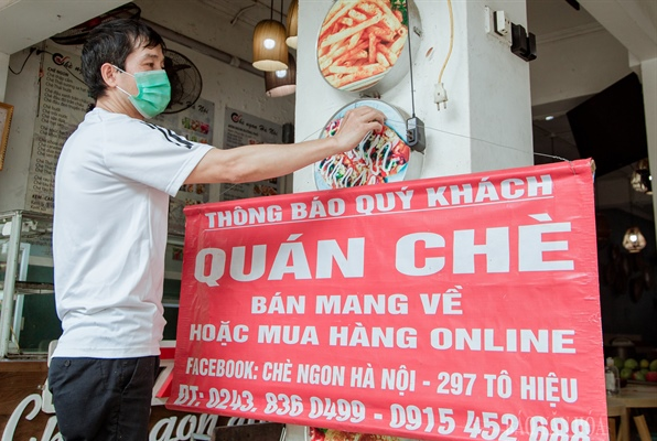 Chủ động, thận trọng để trở lại trạng thái bình thường mới - Anh 1