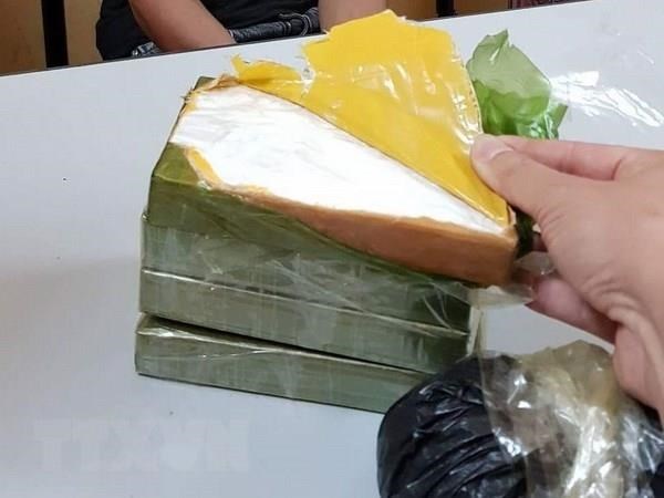 Lào Cai: Bắt quả tang 2 đối tượng vận chuyển 7 bánh heroin - Anh 1