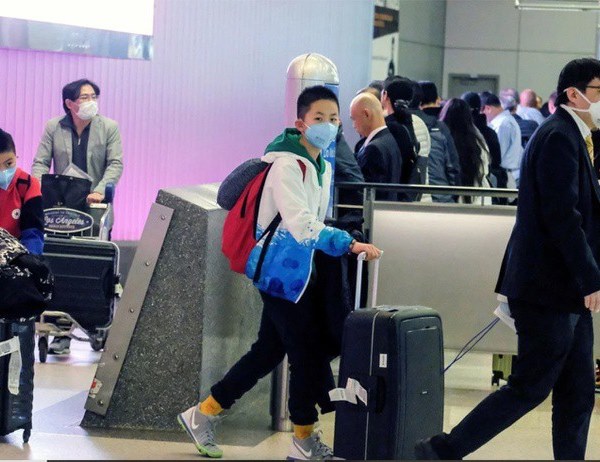 Mỹ xác nhận trường hợp thứ 9 nhiễm virus corona - Anh 1