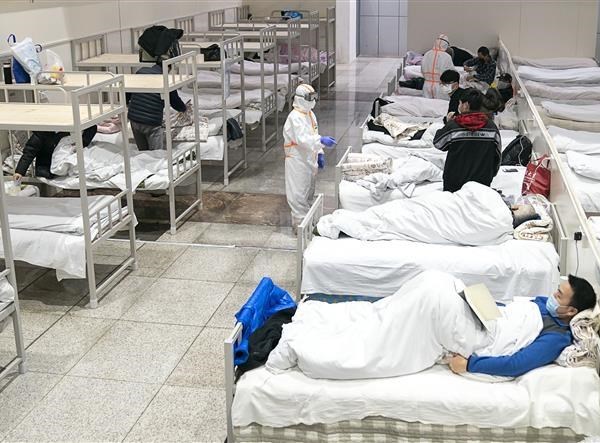 Nhóm chuyên gia của WHO tới Trung Quốc điều tra về tình hình dịch bệnh - Anh 1