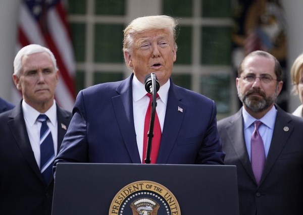 Tổng thống Trump ban bố tình trạng khẩn cấp quốc gia vì Covid-19 - Anh 1