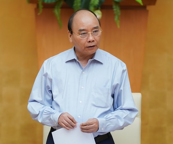 Thủ tướng chủ trì họp Thường trực Chính phủ về Covid-19 - Anh 1