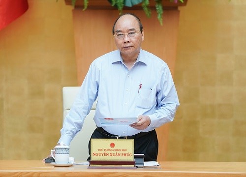 Thủ tướng chủ trì họp Thường trực Chính phủ về Covid-19 - Anh 1