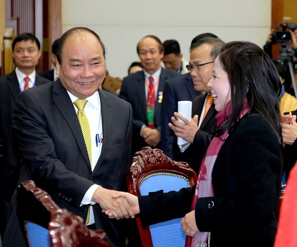 Thủ tướng tiếp đoàn kiều bào về nước đón tết - Anh 4