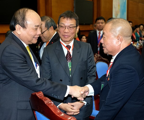 Thủ tướng tiếp đoàn kiều bào về nước đón tết - Anh 5