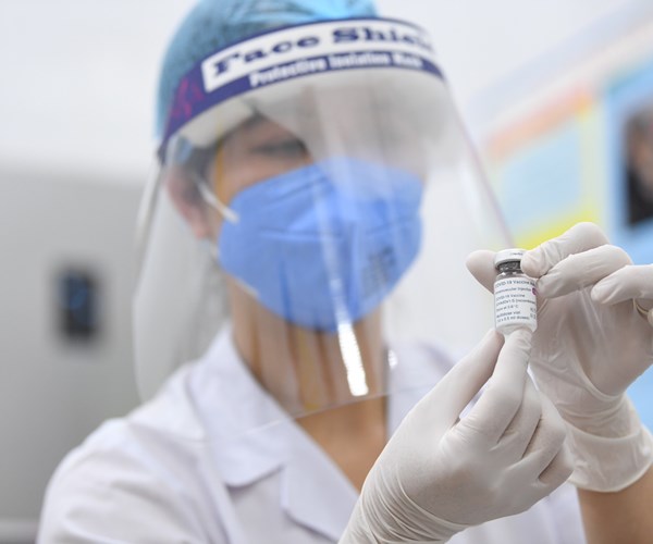 Việt Nam bắt đầu tiêm chủng vaccine phòng, ngừa Covid-19 - Anh 3