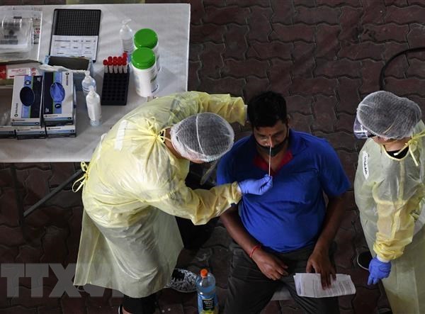 Singapore triển khai tiêm vaccine phòng Covid-19 cho lao động nhập cư - Anh 1