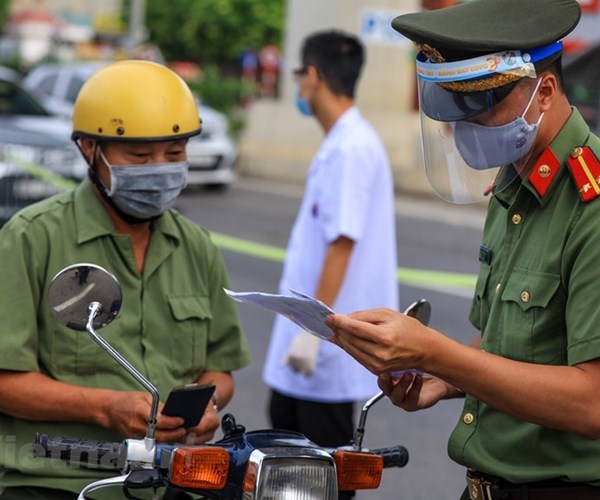 Hà Nội 'kích hoạt' các chốt, đảm bảo phòng chống dịch theo 3 vùng - Anh 1